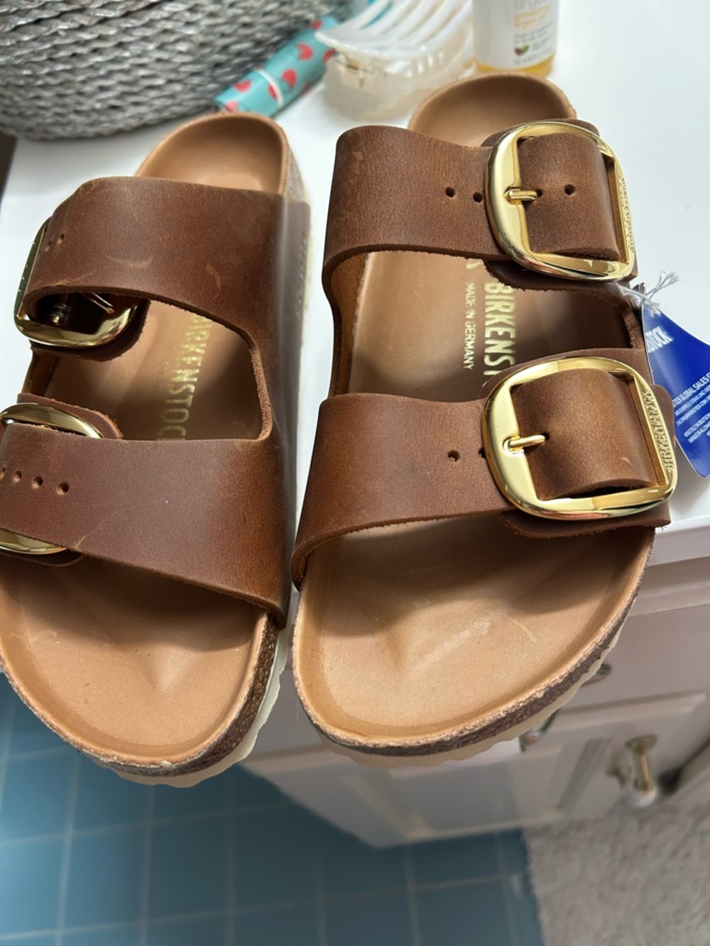 Birkenstock womens Arizona Two-Buckle Sandals in Dark Brown with gold buckle